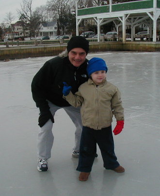 Ray with his grandson Brian standing on the frozen river